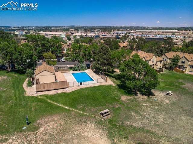 view of swimming pool featuring a residential view and an enclosed area