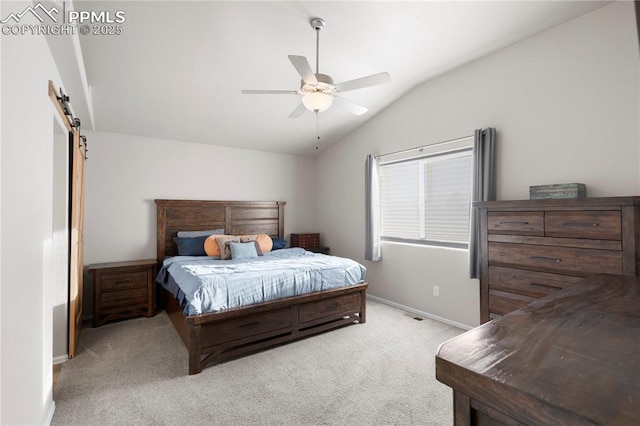 bedroom featuring a barn door, light colored carpet, a ceiling fan, baseboards, and vaulted ceiling