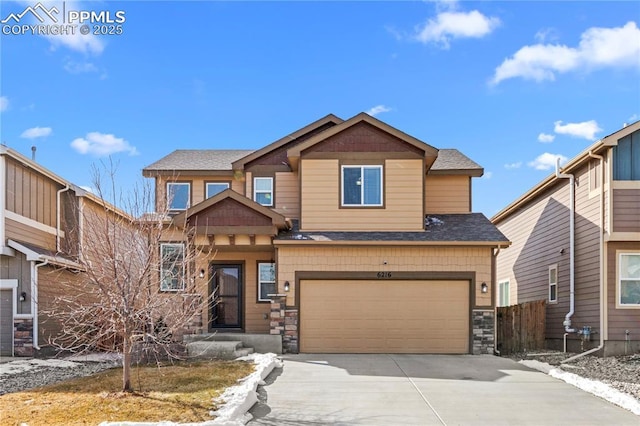 craftsman-style house featuring driveway, stone siding, a shingled roof, and a garage