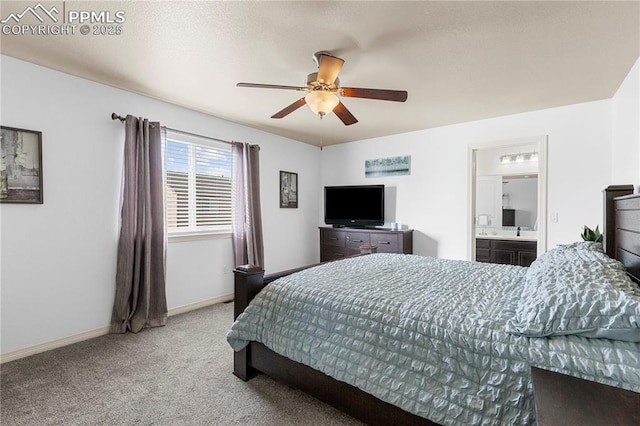 bedroom featuring a ceiling fan, light carpet, connected bathroom, and baseboards