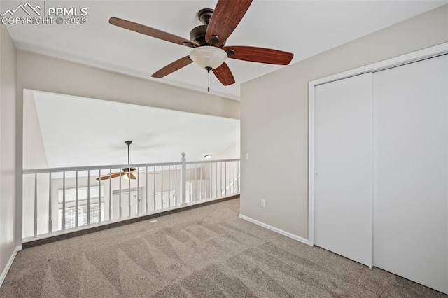 spare room with carpet and baseboards