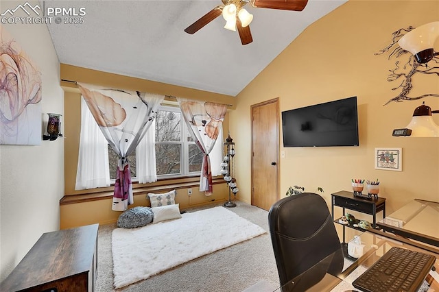 office featuring carpet, vaulted ceiling, and a ceiling fan