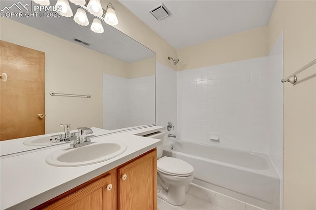 bathroom with toilet, vanity, visible vents, and tile patterned floors