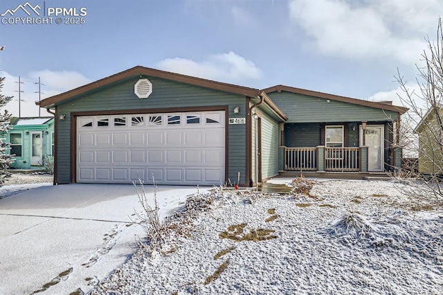 view of front facade featuring driveway, an attached garage, and a porch