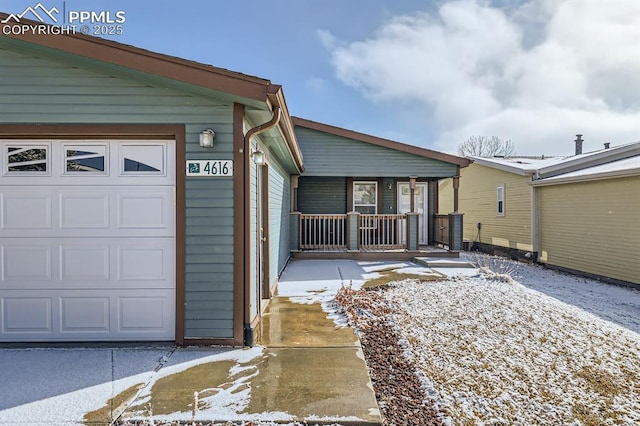 exterior space with a garage and covered porch