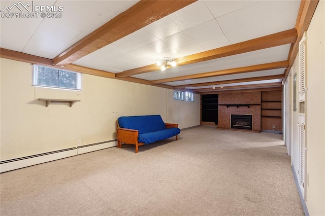 unfurnished room with a baseboard heating unit, beam ceiling, light colored carpet, and a fireplace