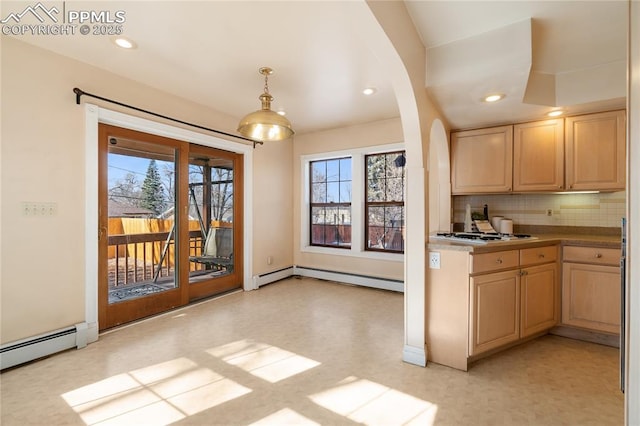 kitchen with a baseboard heating unit, pendant lighting, light brown cabinets, and white gas stovetop