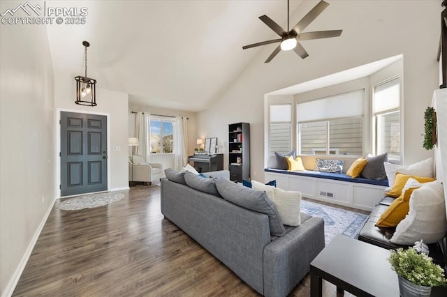 living room with high vaulted ceiling, wood finished floors, a ceiling fan, visible vents, and baseboards