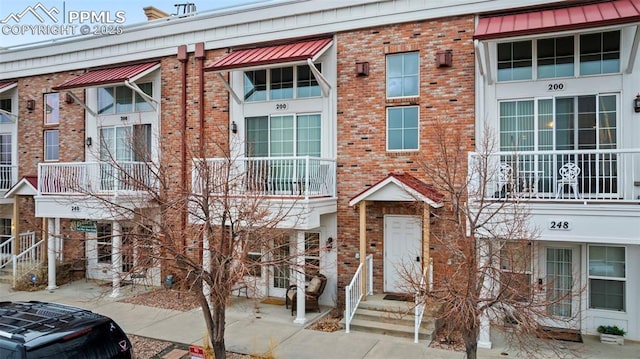 view of front of house featuring brick siding