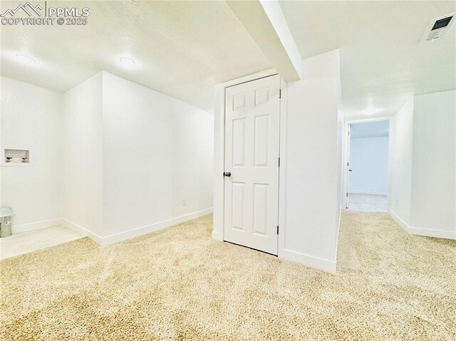1108 W 16th St, Pueblo, CO 81003 - spare room featuring light carpet, visible vents, and baseboards