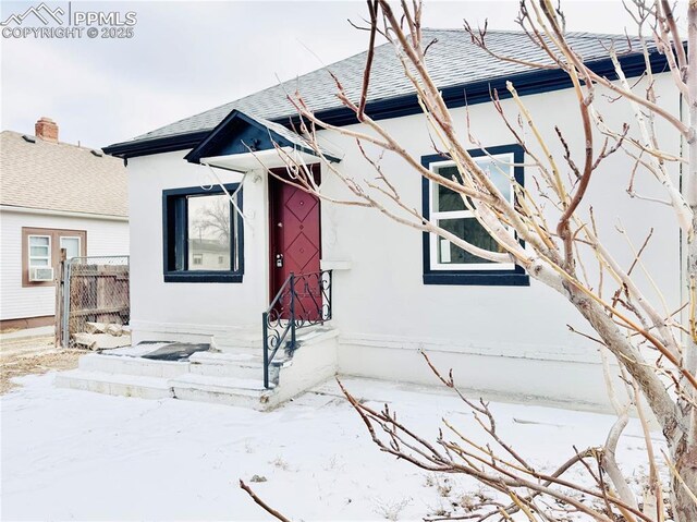 1108 W 16th St, Pueblo, CO 81003 - exterior space featuring a shingled roof, cooling unit, and fence