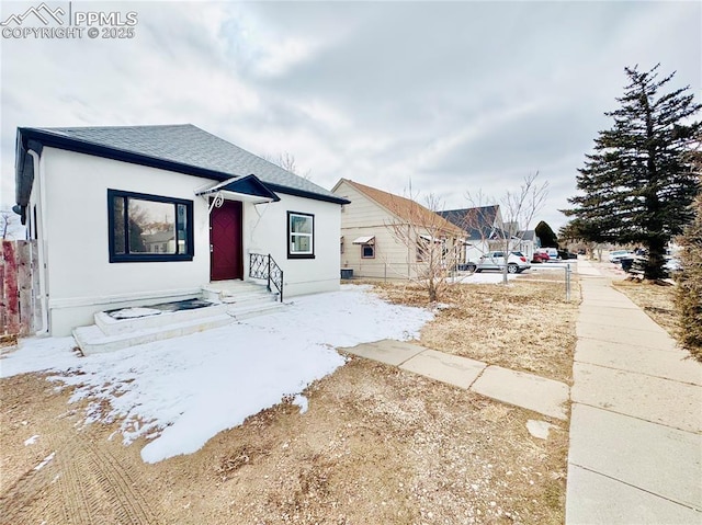 1108 W 16th St, Pueblo, CO 81003 - bungalow-style house featuring roof with shingles and stucco siding
