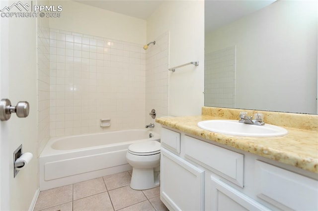 bathroom featuring tile patterned flooring, vanity, toilet, and shower / bathtub combination