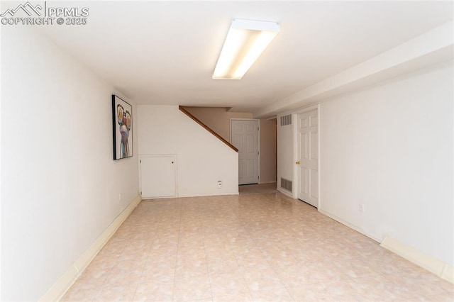 empty room featuring visible vents and baseboards