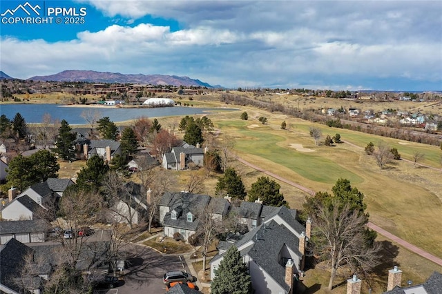 aerial view featuring a water and mountain view