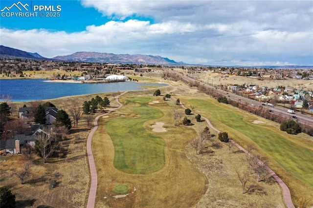 aerial view featuring golf course view and a water and mountain view