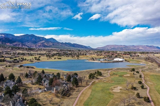 aerial view featuring a water and mountain view