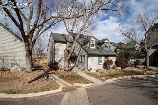 view of front of home with a shingled roof