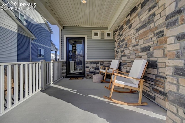 entrance to property featuring stone siding