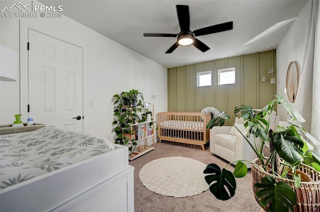 bedroom with ceiling fan and light colored carpet