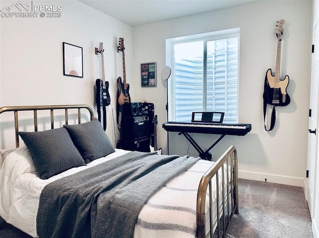 carpeted bedroom with baseboards