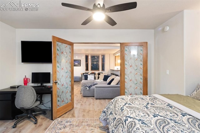 bedroom with ceiling fan and light wood finished floors