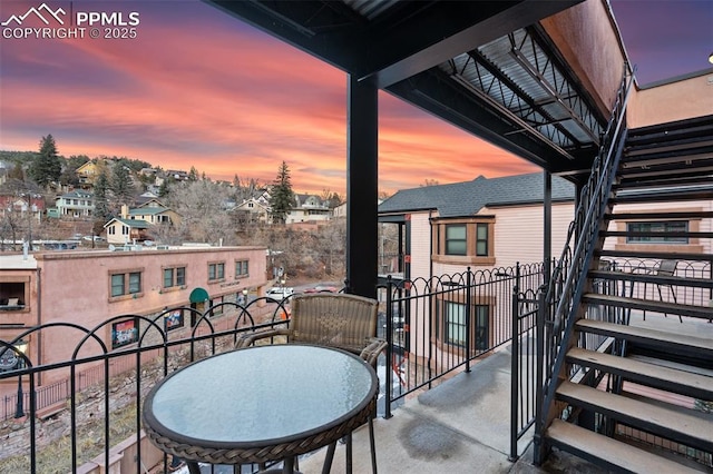 balcony at dusk with a residential view