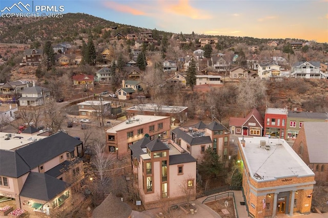 aerial view at dusk featuring a residential view