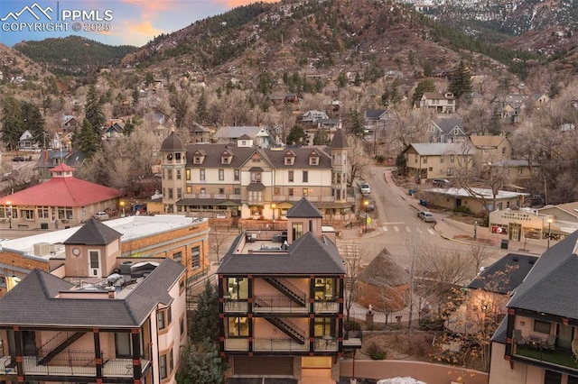 aerial view at dusk featuring a residential view