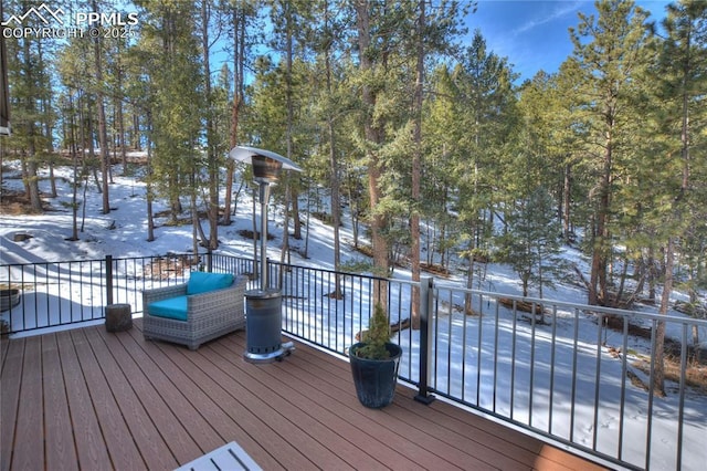 view of snow covered deck