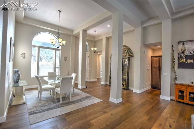 dining room featuring an inviting chandelier, baseboards, dark wood-type flooring, and recessed lighting