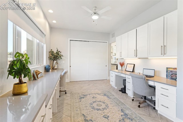 home office with built in study area, visible vents, a ceiling fan, and recessed lighting