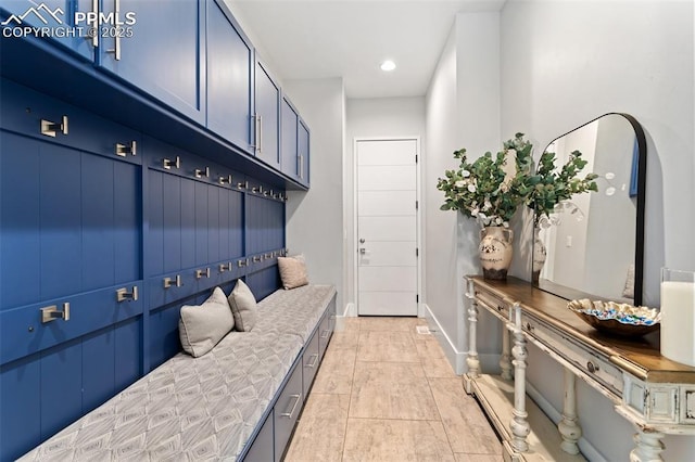 mudroom with recessed lighting, baseboards, and light tile patterned floors