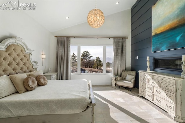 bedroom featuring high vaulted ceiling and recessed lighting