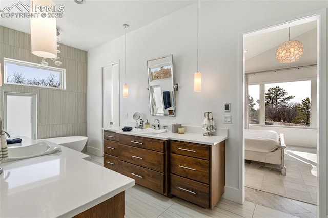 full bathroom featuring connected bathroom and vanity