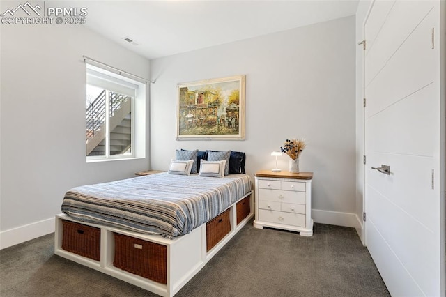 bedroom featuring visible vents, dark carpet, and baseboards