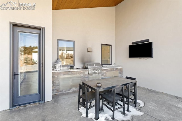 view of patio / terrace with outdoor dining space and area for grilling