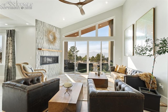 living room featuring recessed lighting, a fireplace, lofted ceiling, and ceiling fan