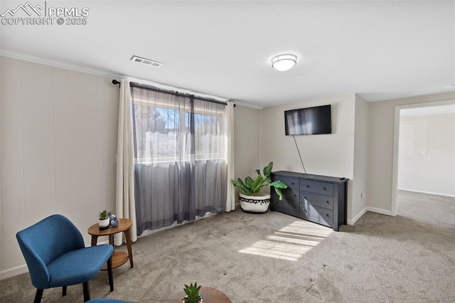 living area with carpet flooring and visible vents