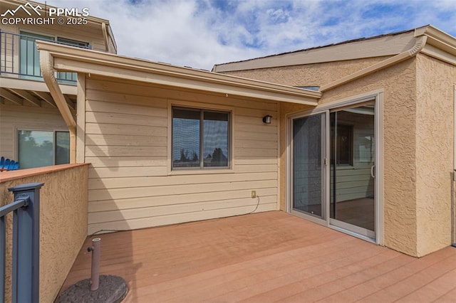 exterior space featuring a deck and a balcony