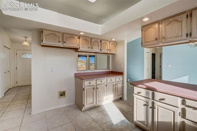 kitchen with recessed lighting, light countertops, baseboards, and light tile patterned flooring