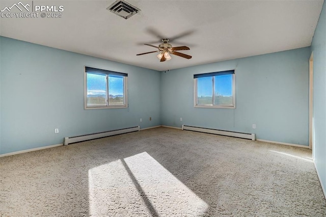 spare room featuring baseboards, visible vents, a ceiling fan, a baseboard radiator, and baseboard heating