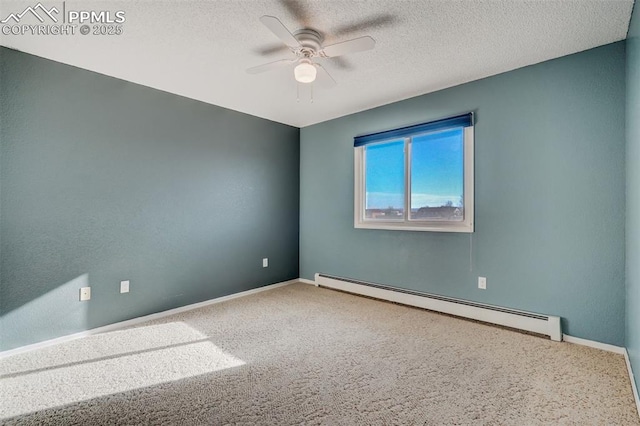 empty room with a textured ceiling, carpet flooring, a ceiling fan, baseboards, and baseboard heating