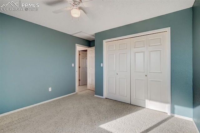 unfurnished bedroom featuring baseboards, ceiling fan, a closet, and light colored carpet