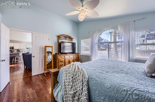 bedroom with dark wood-style flooring and a ceiling fan