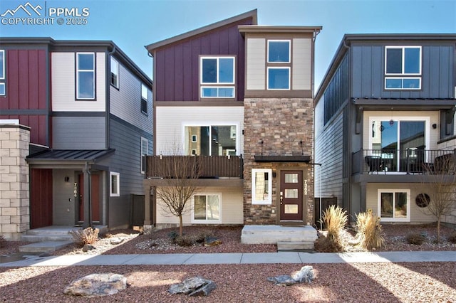 view of front of property featuring stone siding and board and batten siding