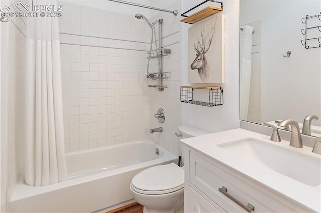 bathroom featuring shower / bath combo, vanity, and toilet