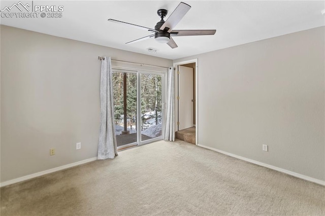 empty room with a ceiling fan, visible vents, baseboards, and carpet flooring