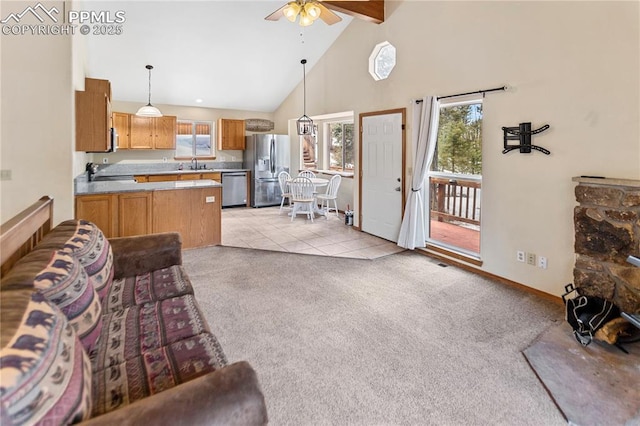 living room featuring light carpet, ceiling fan, high vaulted ceiling, beamed ceiling, and baseboards