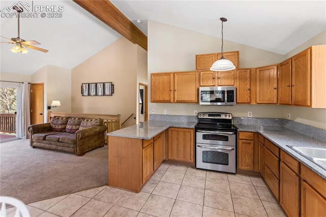 kitchen featuring light tile patterned floors, stainless steel appliances, open floor plan, light carpet, and a peninsula